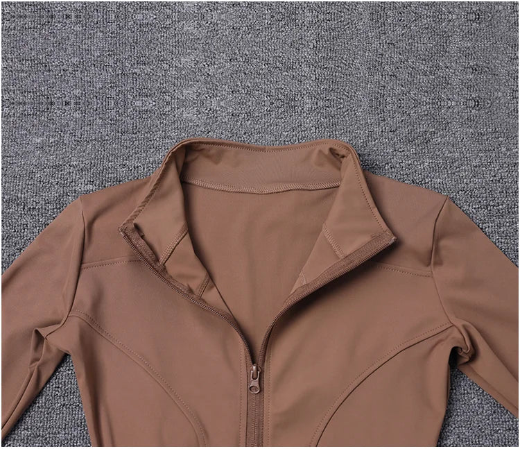 Chaqueta deportiva de manga larga para mujer, ideal para entrenar en el gimnasio o practicar yoga.