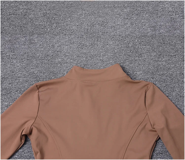 Chaqueta deportiva de manga larga para mujer, ideal para entrenar en el gimnasio o practicar yoga.