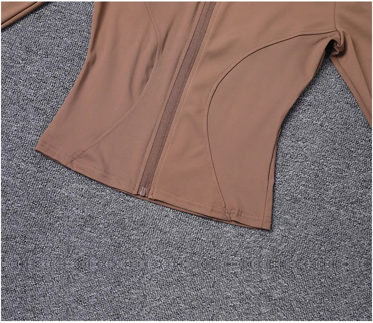 Chaqueta deportiva de manga larga para mujer, ideal para entrenar en el gimnasio o practicar yoga.