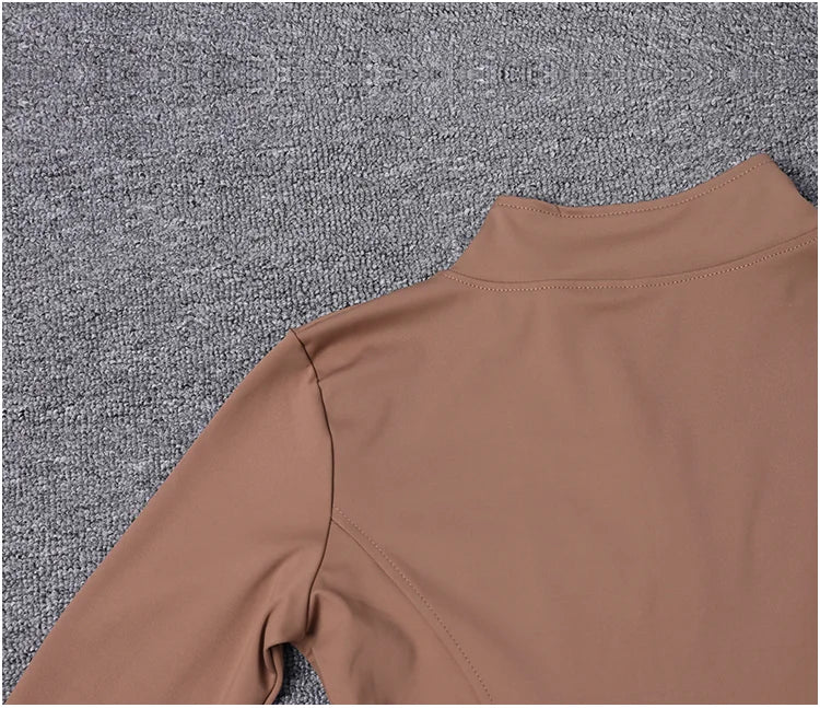 Chaqueta deportiva de manga larga para mujer, ideal para entrenar en el gimnasio o practicar yoga.